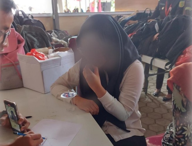 wanita muda inisial RT (20) tertangkap tangan menjadi joki tes CPNS 2023